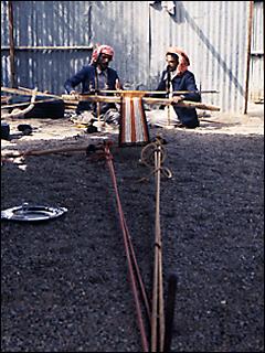 2 male weavers